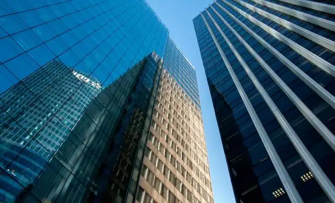 blue glass walled high rise building